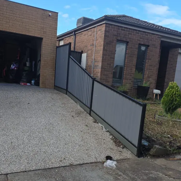 Colorbond fence following a steep slope, installed for Raymond