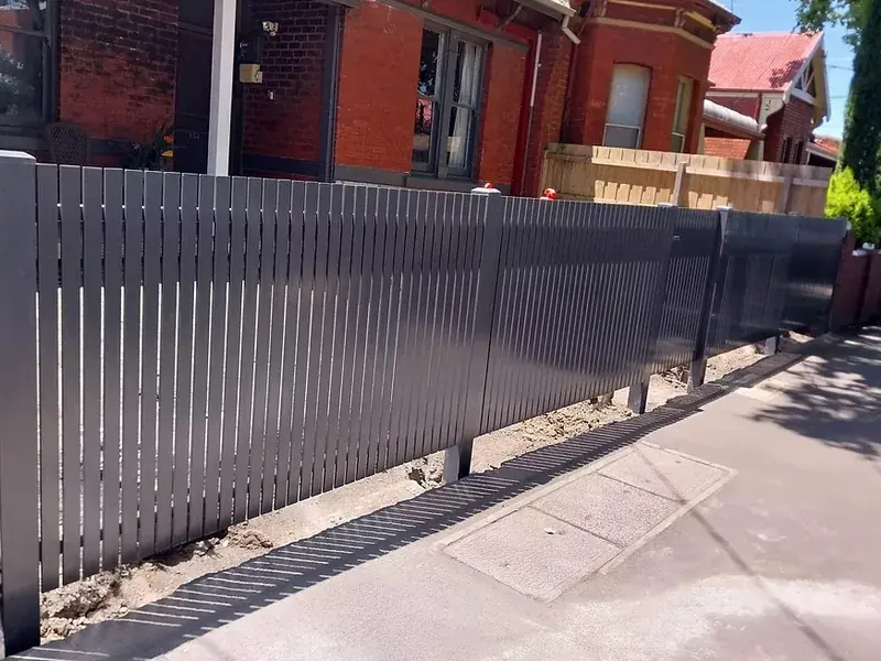 Vertical aluminium and steel picket front fence in charcoal