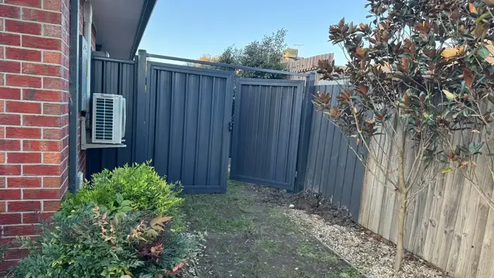 Double Colorbond side gate in Monument installed beside a brick home