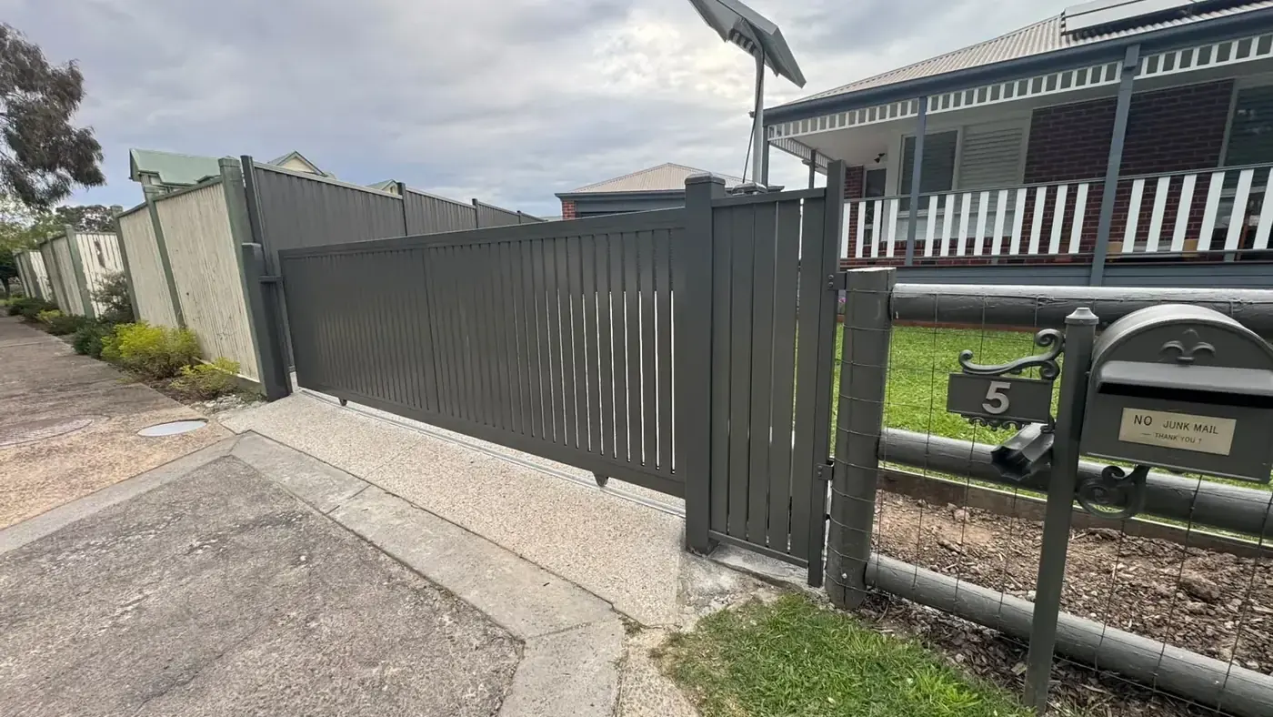 Sliding gate and pedestrian gate by Mickleham Fencing near Kalkallo