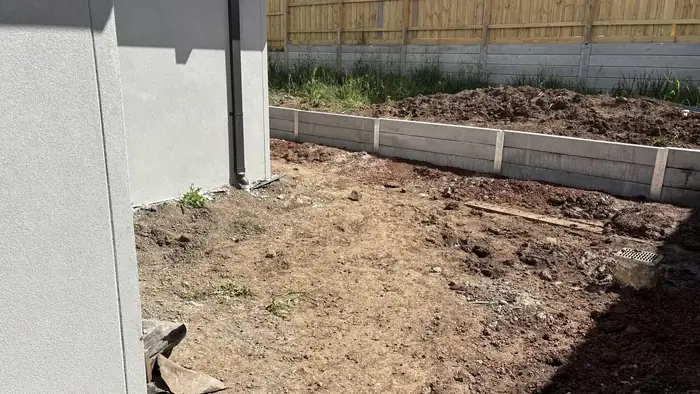 20 metre concrete sleeper retaining wall built along a side boundary